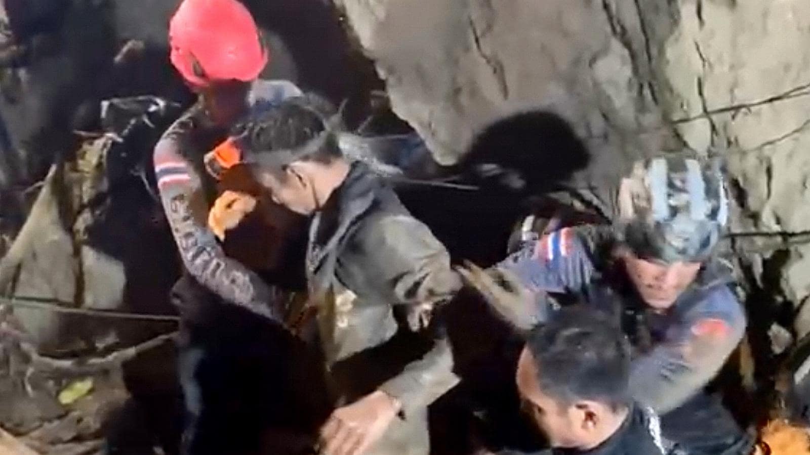 Villager rescued from Laos cave, divers go back for others trapped